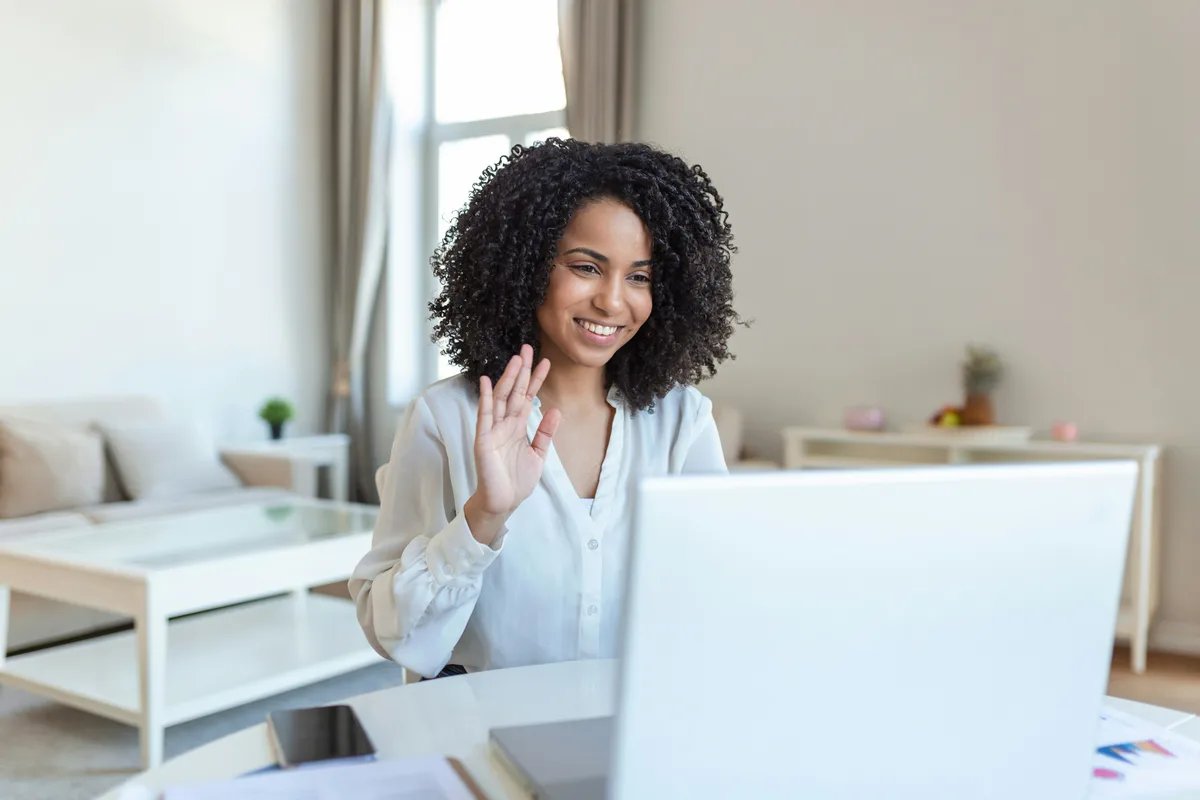 Comfortable virtual consultation setup with pelvic health physiotherapist on screen